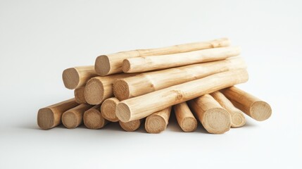 Stacked light wood logs on white background; natural texture
