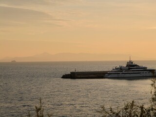 Fototapeta premium Sunset on the Pasalimani from Votsalakia beach, Piraeus, Greece
