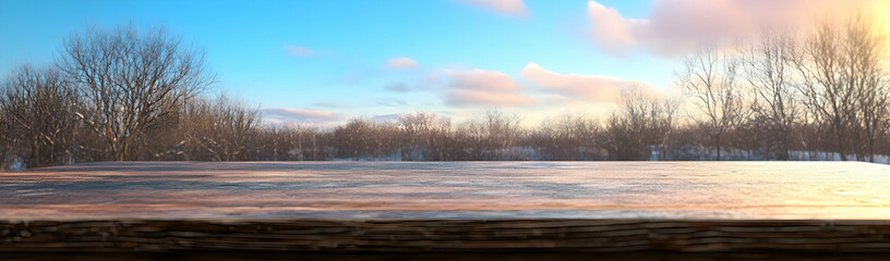 Winter sunset, snowy landscape, wooden table