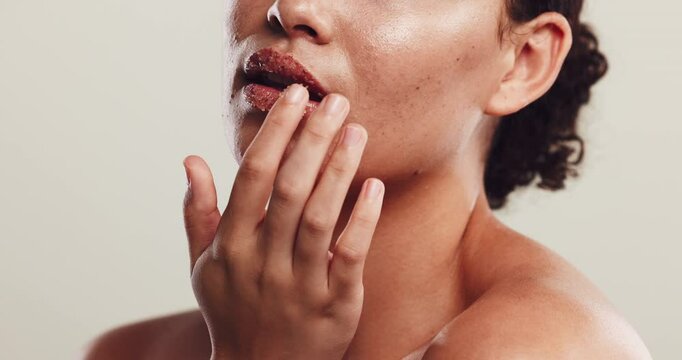 Studio, woman and lips with sugar scrub for skincare, cleaning and product for natural peeling. Closeup, mouth and female person with application for cosmetics, exfoliation and white background