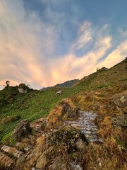 View of rice terraces with mountains in the background. Kajoran, Indonesia.

View of sunrise with reddish sky in a mountainous landscape. Kejajar, Wonosobo, Indonesia.