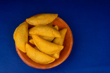 Colombian empanada with spicy sauce 