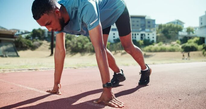 Sport, man and getting ready to start on track for speed performance, pace control and endurance training. Begin, set and running take off at stadium for marathon fitness, race practice and workout