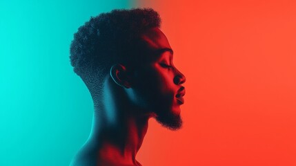 Serene profile portrait of a young Black man illuminated by vibrant teal and red lighting, eyes closed in peaceful contemplation.