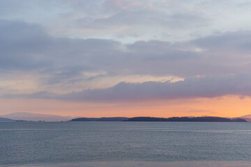 Gorgeous Ocean Sunset with Scenic Islands and Distant Mountains