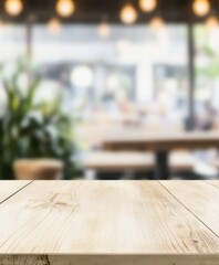 Wooden table top against a blurred restaurant background, perfect for showcasing a product or food item.