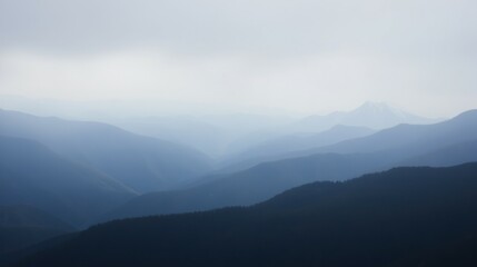 Fototapeta premium Serene Misty Mountain Range with Layers of Blue and Gray Tones