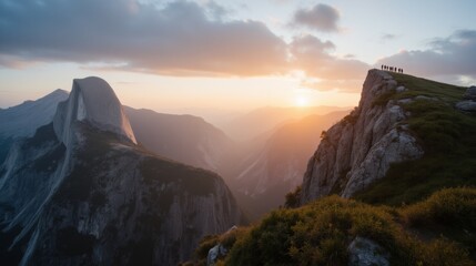Breathtaking Sunset Over Mountain Peaks with Silhouetted Hikers