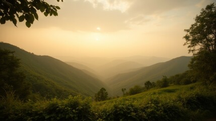 Serene Mountain Landscape at Sunset with Soft Mist and Green Hills