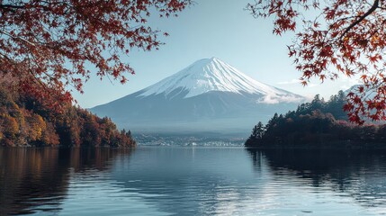 Autumn view of Mount Fuji reflected on lake, framed by colorful trees