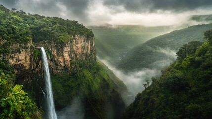 Waterfall cascading down canyon, misty rainforest, travel poster