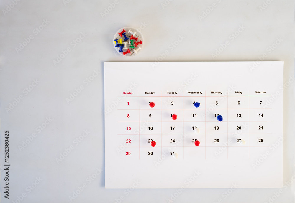 Poster push pin stack in calendar background