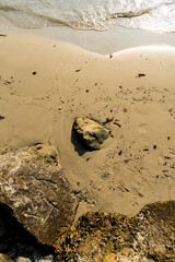 Stones on the summer sand along the tropical beach