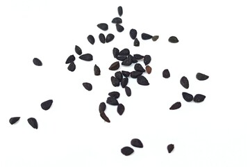 Black cumin seeds pile isolated on white background