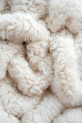 Close-up of white wool, soft texture, detail background. Perfect for textile needs
