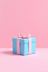 there is a blue gift box with a pink bow on it