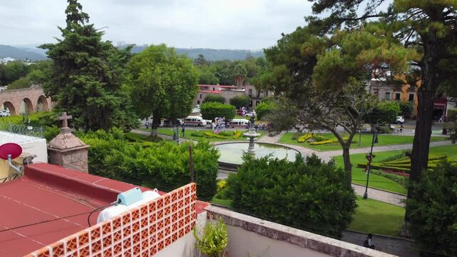 Cozy terrace overlooking a fountain in downtown Morelia aerial view