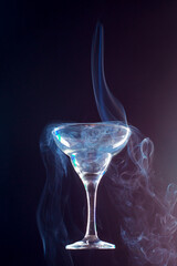 levitating glass full of smoke on a black background