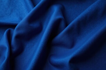 Fototapeta premium Deep Blue Draped Fabric A Textured Close-Up Showing Soft Waves and Gentle Undulations