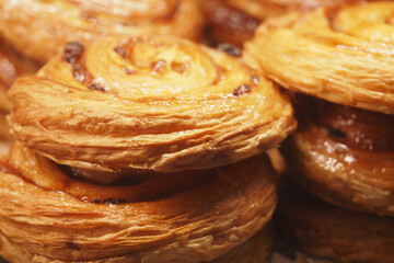 Warm and flaky pastries arranged in a bakery display case