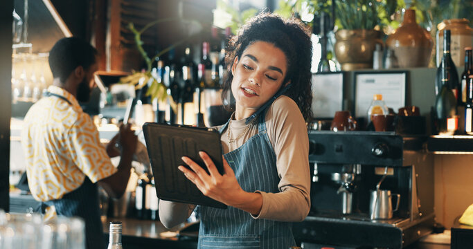 Phone call, tablet and planning with woman in restaurant for product inventory, supplier contact or budget discussion. Menu discount, bar service and small business owner with employee in coffee shop