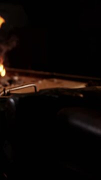 Iron rod being heated in fire