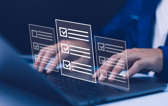 A person types on laptop with digital survey checklists, symbolizing online surveys, test-taking, and data collection. The concept represents digital forms, education, and modern learning technology.