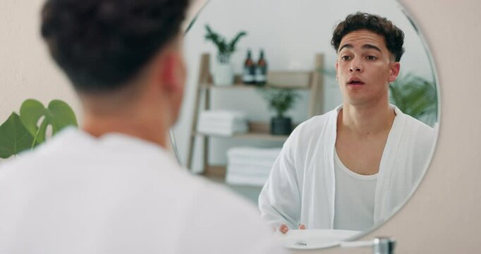 Man, mirror and face for motivation at home of self care pep talk, morning routine and skincare beauty. Male person, reflection and grooming affirmations, wellness benefits and confidence in bathroom