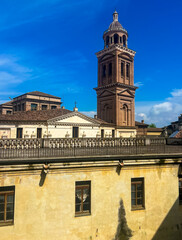 Obraz premium Bell tower of the santa barbara church surrounded by magnificent Mantua skies