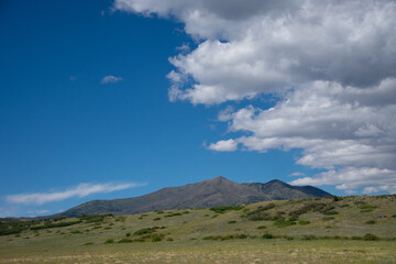 Clouds and blue skies over mountains in Southern Colorado