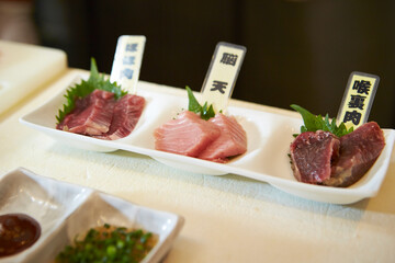 Several cuts of tuna on a plate