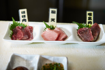 Several cuts of tuna on a plate