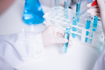 Close-up scientist pipette drop to test tube laboratory research chemistry chemical science research