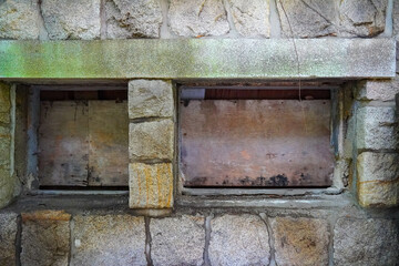 A collection of various exterior windows on buildings, showcasing diverse architectural styles and materials.