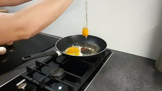 Tasty eggs being fried in oil