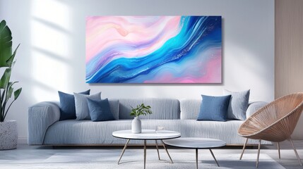 A bright living room features a cozy light gray sofa adorned with blue cushions and a round coffee table. A colorful abstract painting adds vibrancy to the space, which is accented by plants
