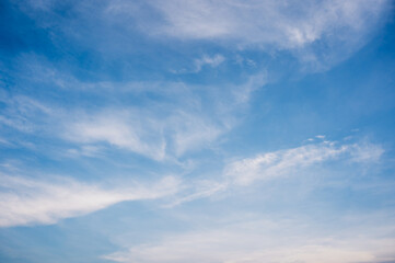 Cirrus cloud with sunset light over blue sky.  nature wallpaper  background.