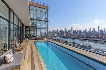Obraz premium Rooftop pool with city view, ideal for luxury real estate marketing