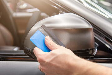 The process of installing PPF matte film on the side of the car. PPF is a polyurethane, protective...