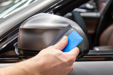 The process of installing PPF matte film on the side of the car. PPF is a polyurethane, protective...