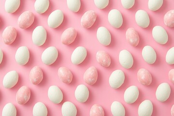 Pastel pink and white egg pattern on pink background.