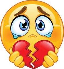 Sad Emoji Emoticon with Teary Eyes Holding a Broken Red Heart