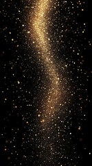 Sparkling golden dust swirls gracefully against a dark background