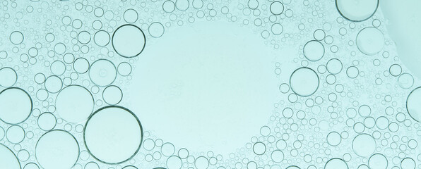 Macro microscope green bubble texture, Close-up Green bubbles and drops oil background . blue green water bubbles, close up golden oil drop for cosmetic...