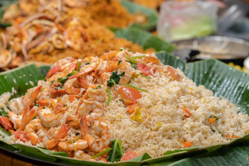 Fried rice with shrimp and vegetables. The rice is perfectly cooked and mixed with succulent shrimp and carrots, tomatoes and egg.