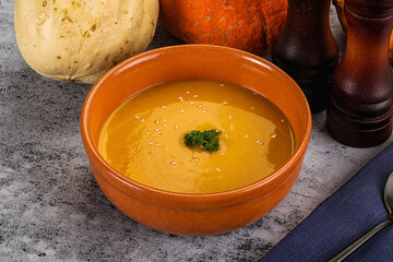 Vegan pumpkin cream soup served sesam