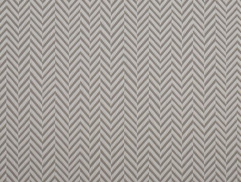 classic herringbone patterned fabric with alternating light and dark threads for stylish and decorative textile applications