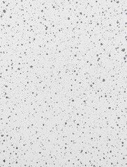 Fototapeta premium textured white surface with gray and black speckles and visible cracks aged weathered appearance