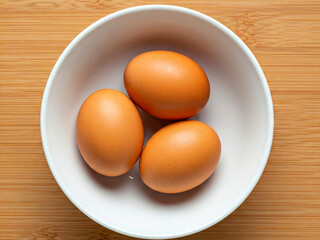 This close-up shot features eight eggs nestled in a simple white container. The container has a ridged design on the outside, adding a touch of visual texture to the composition.