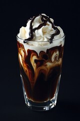 Cold chocolate espresso drink with vanilla ice cream and whipped cream. Handcrafted latte art.